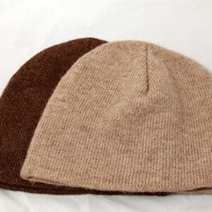 Two hats are shown side by side on a white surface.
