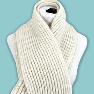 A white scarf is wrapped around the neck of someone.