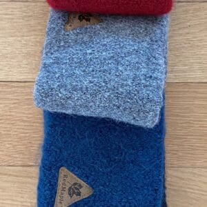 A close up of three different colored sweatbands