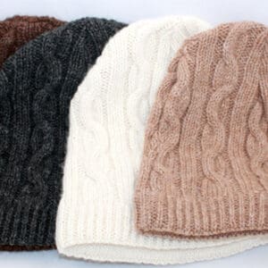 A group of four hats sitting next to each other.