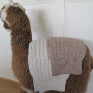 A stuffed animal with diapers on it's back